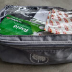 Useful Travel Medical Kit Items (With Kids) Items in a travel medical kit in a small waterproof packing cube