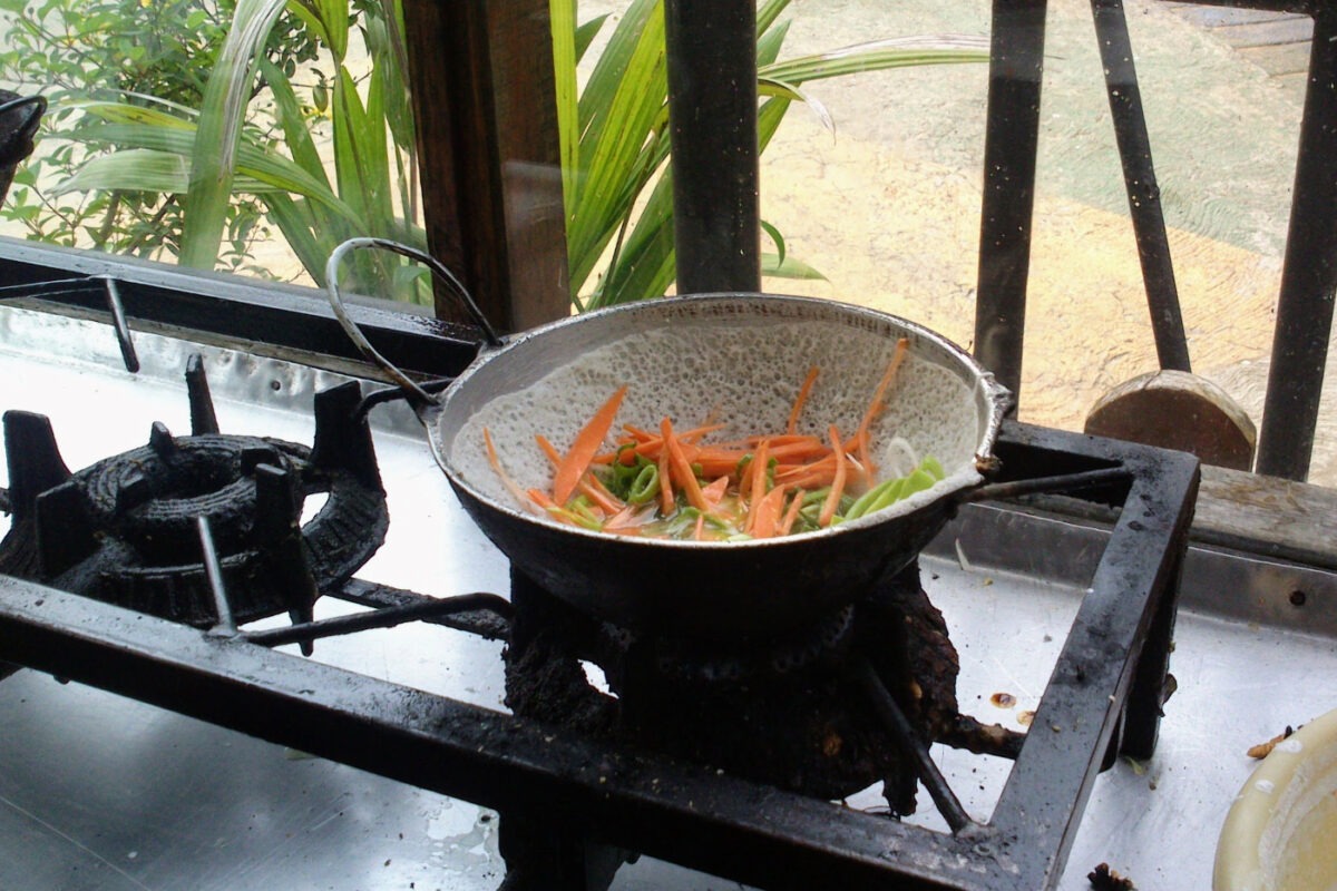 making hoppers at a roadsite food stall in Sri Lanka