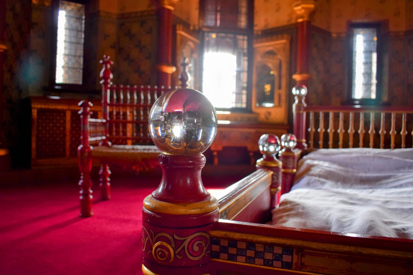 Lady Bute's bedroom at Castell Coch. Elaborate crystal balls on the bed frame.