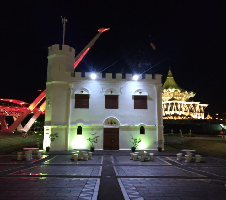The square tower kuching lit up at night