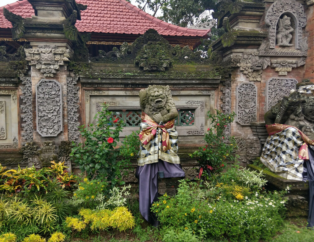 Bali typical gardens and statues, architecture.