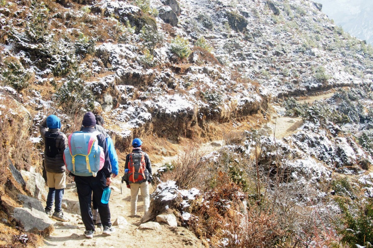 children on a hiking trail in the Himalayas of Nepal