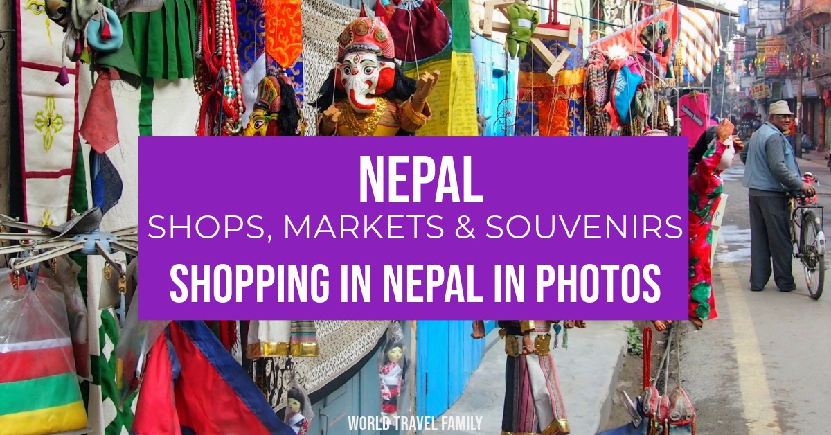 a gift shop on a street in Kathmandu selling traditional Nepali dolls and prayer flags