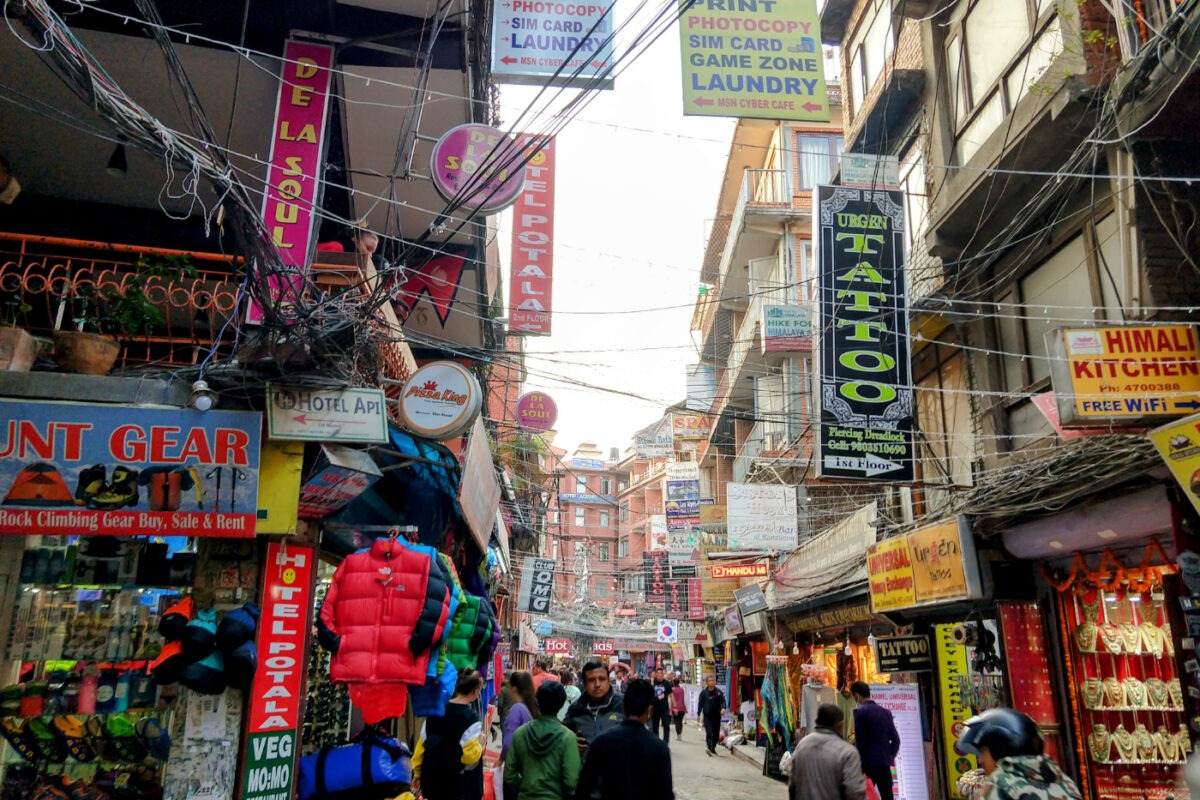 A busy street in Thamel lined with shops